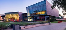 The Muenster University Center exterior during a summer evening.